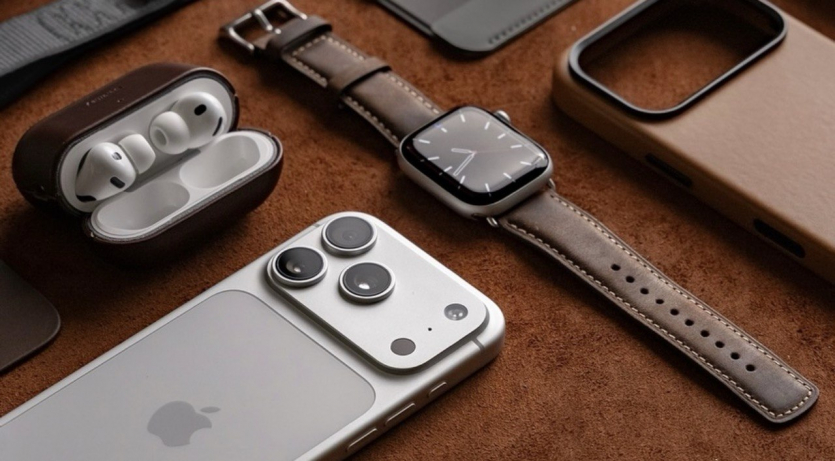 Близький план преміальних аксесуарів Nomad із натуральної шкіри Horween: чохол для iPhone, ремінець Apple Watch та кейс AirPods.